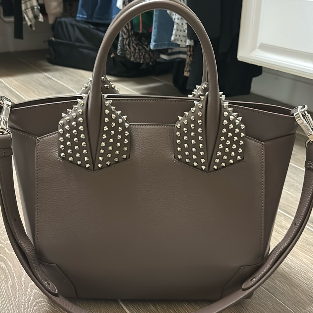 Christian Louboutin tote with strap.
